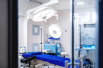 Interior of modern hospital with operating room details. Empty emergency surgery room with medical equipment