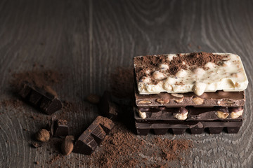 Chocolate / Chocolate bar on dark wooden background