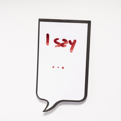 a white memo pad with the shape of a comic with the inscription "I say..."