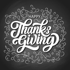 Happy thanksgiving brush hand lettering with sketch branches with leaves on black chalkboard background. Calligraphy vector illustration. Can be used for holiday design.