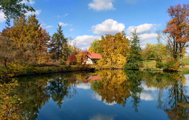Fototapeta premium Autumnal park with a lake