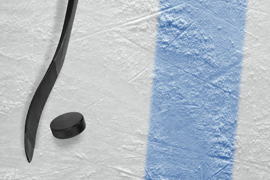 Hockey stick and washer on ice