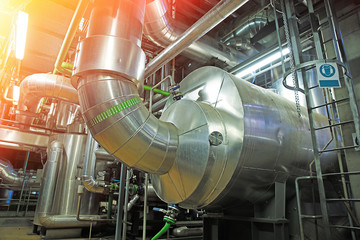 Equipment, cables and piping as found inside of a modern industrial power plant