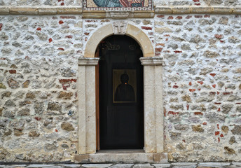 Fototapeta na wymiar Entrance into main stone church monastery Hopovo in Serbia