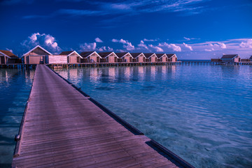Sunset water bungalows at a luxury resort