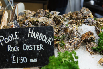 poole harbour rock oyster with a price label