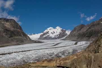 glacier Aletsch with blue sky and clouds