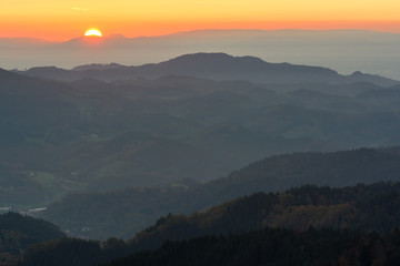 Autumn landscape - Black Forest. Panoramic view over the autumnal Black Forest, the Rhine valley and the Vosges (France) in the distance at sunset.
