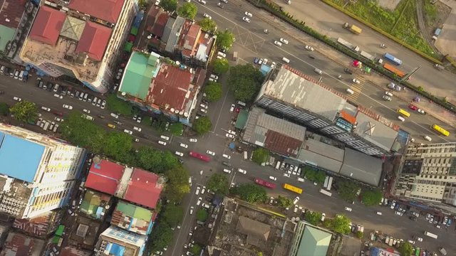 4K Aerial, the camera slowly goes down over road junction,streets at China Town and city of Yangon,Myanmar