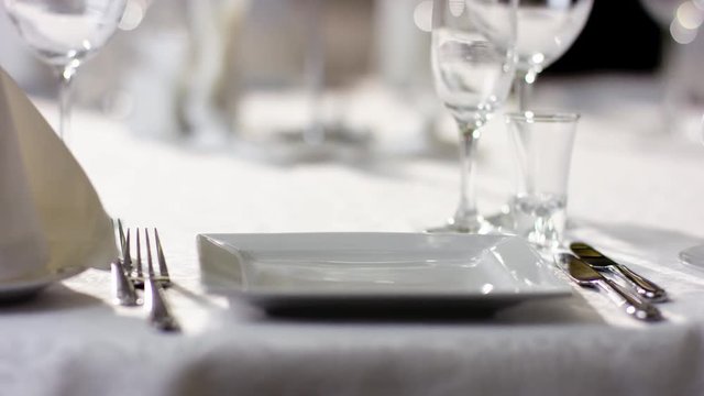 Shot of plate with fork and knife on a banquet table at luxury restaurant