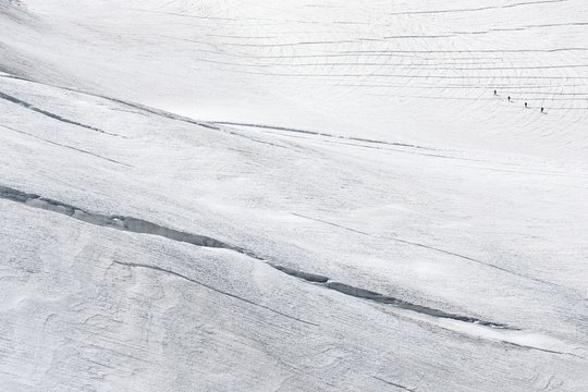 Alpinists on Aletsch glacier, view from Jungfraujoch, the highest railway station in the Alps,Berner Oberland,Interlaken,Switzerland