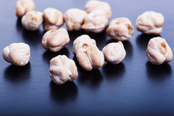 Dry chickpeas on dark background