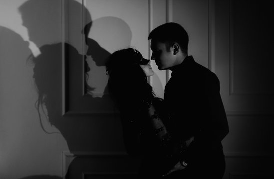 woman  with  theatrical mask and handsome man