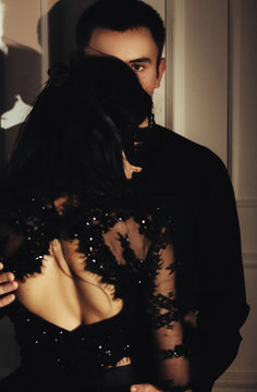 woman  with  theatrical mask and handsome man