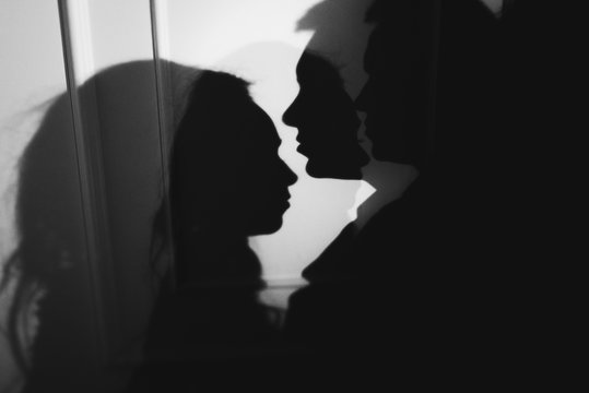 woman  with  theatrical mask and handsome man