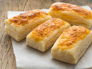 few fresh rolls with a delicious crust of puff pastry, close-up, selective focus,