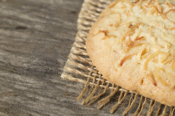 Coconut cookie on rustic wooden background