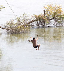 man on the bungee on the river