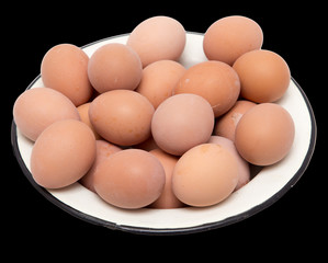 boiled eggs in a bowl on a black background