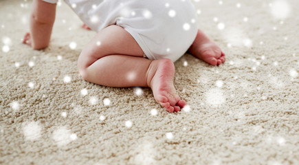 little baby in diaper crawling on floor