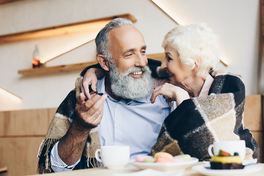 Elderly Couple In Cafe