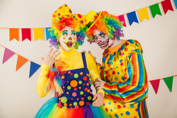 a terrible clown and a good clown. Halloween. The crazy clown and clowness.