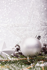 Christmas composition of Christmas tree toys on a silver background