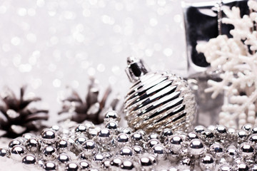 Christmas composition of Christmas tree toys on a silver background