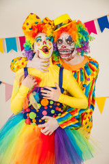 a terrible clown and a good clown. Halloween. The crazy clown and clowness.