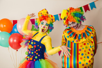 a terrible clown and a good clown. Halloween. The crazy clown and clowness.