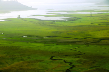 Top view from hill have green grass and river