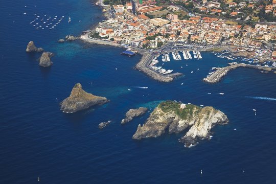 Aerial view of the marine protected area of the Cyclops Islands, Acitrezza, Sicily, Italy