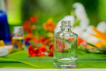 natural cosmetics bottle containers with green leaf on white background,natural beauty skincare product,  beauty product concept