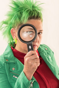 A Caucasian Girl In A Green Dress And Green Hair Is Preparing For The Holidays. Dress Rehearsal. The Concept Of Happy Holidays And Good Mood