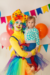 clown girl and little baby. Celebration. Birthday
