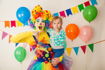 Obraz na płótnie Canvas clown girl and little baby. Celebration. Birthday
