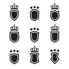 Shields set. Collection of different shield shapes with crown and stars. Heraldic royal design in flat style. Vector illustration.