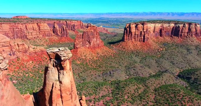 Dramatic Red Buttes In Desert Valley - Colorado National Monument