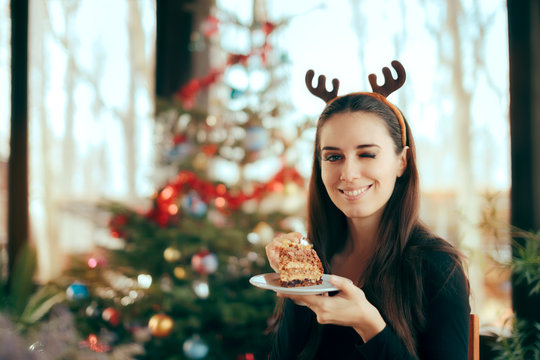 Happy Woman Eating Cake at Christmas Dinner Party