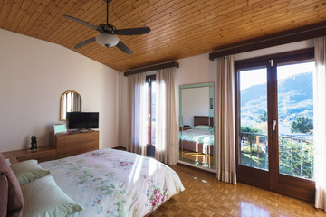Bedroom with floor and wooden ceiling