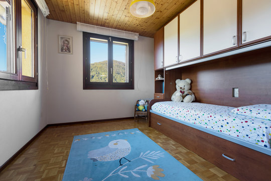 Bedroom with floor and wooden ceiling
