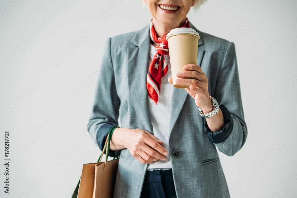 Wall mural woman with shopping bags and coffee