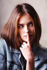 Naklejka premium Portrait of young pensive bright beautiful European girls in the denim jacket
