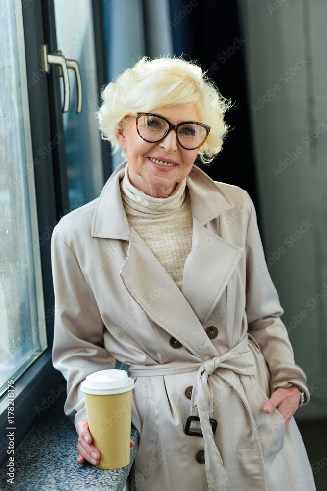 Wall mural senior woman with coffee