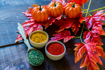 Fall background spices and leaves with pumpkins