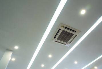 Lighting and ceiling mounted air conditioner