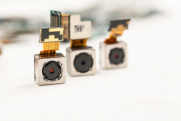 Smartphone camera modules on a white background, closeup