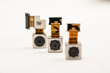 Smartphone camera modules on a white background, closeup