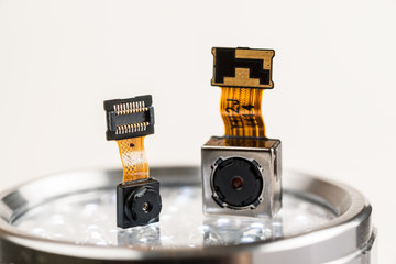 Smartphone camera modules on a white background, closeup