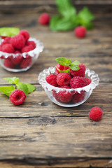 Fresh sweet raspberry on the wooden table